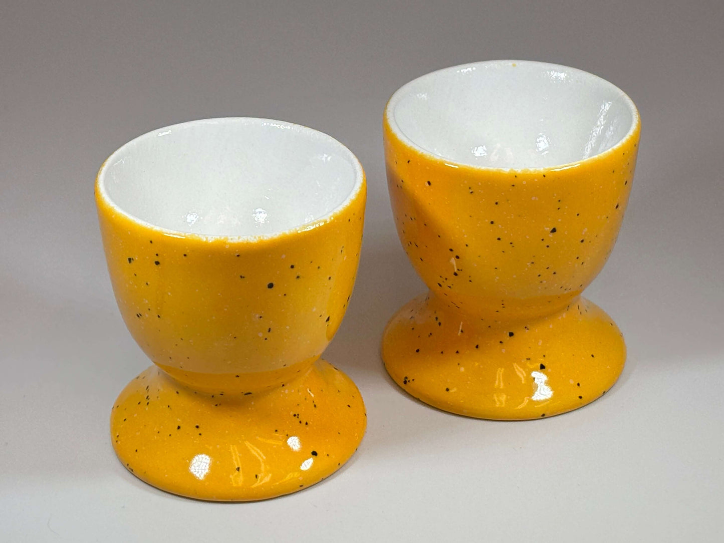 yellow ceramic egg cups