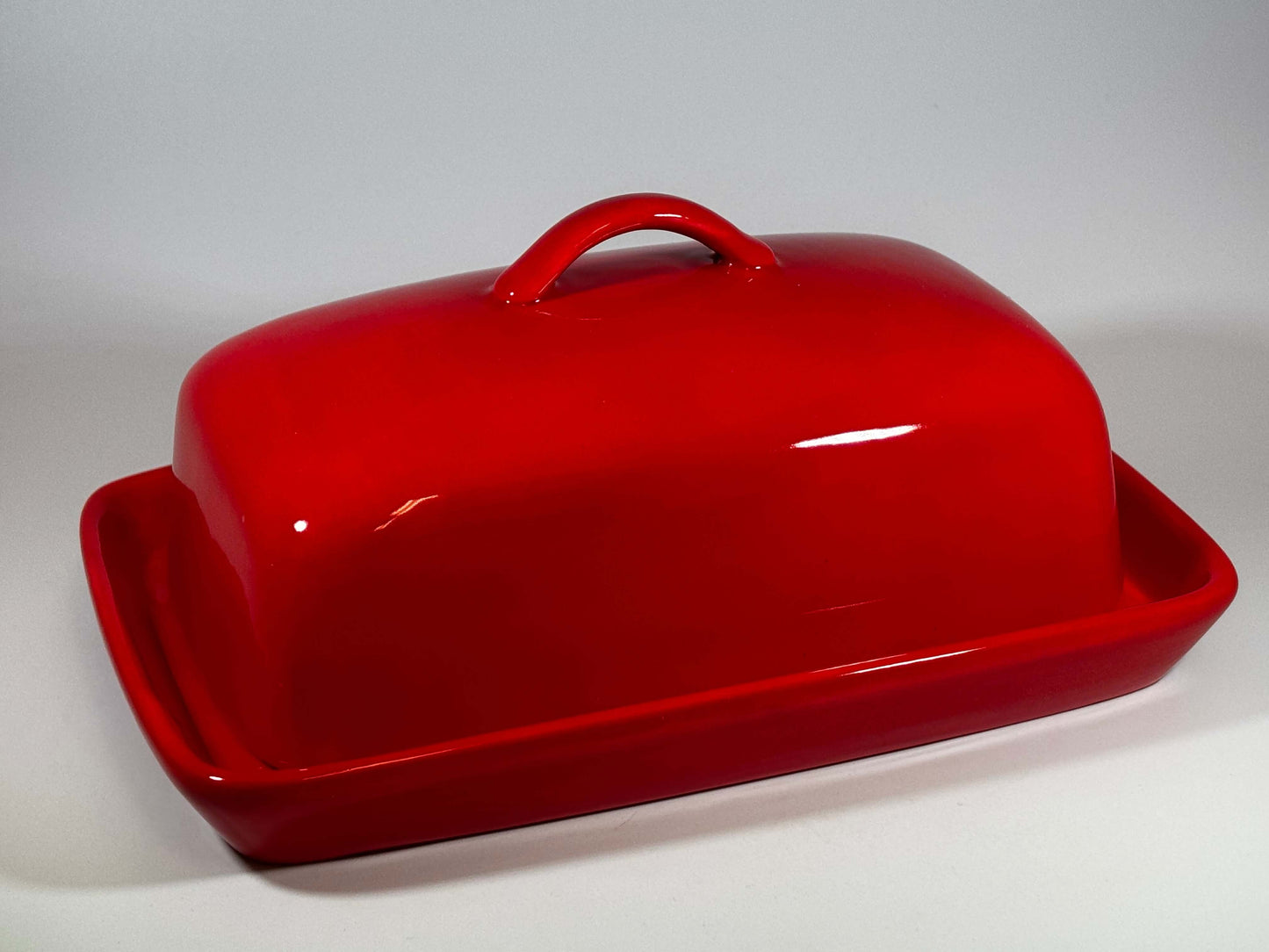 stoneware butter dish in red glaze